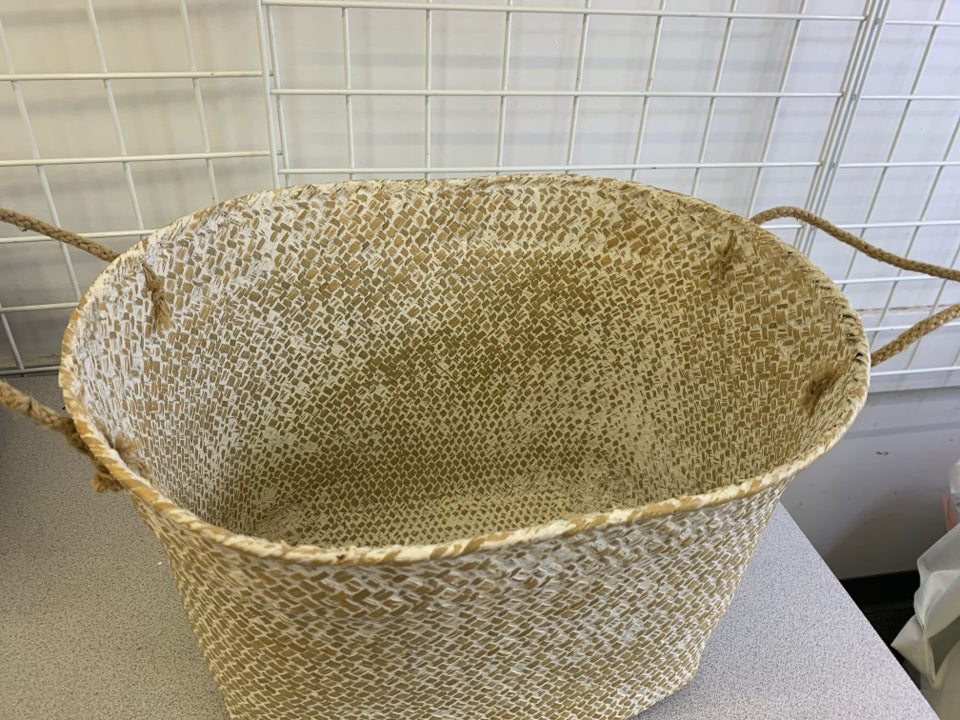 CREAM AND BROWN OVAL BASKET W HANDLES.