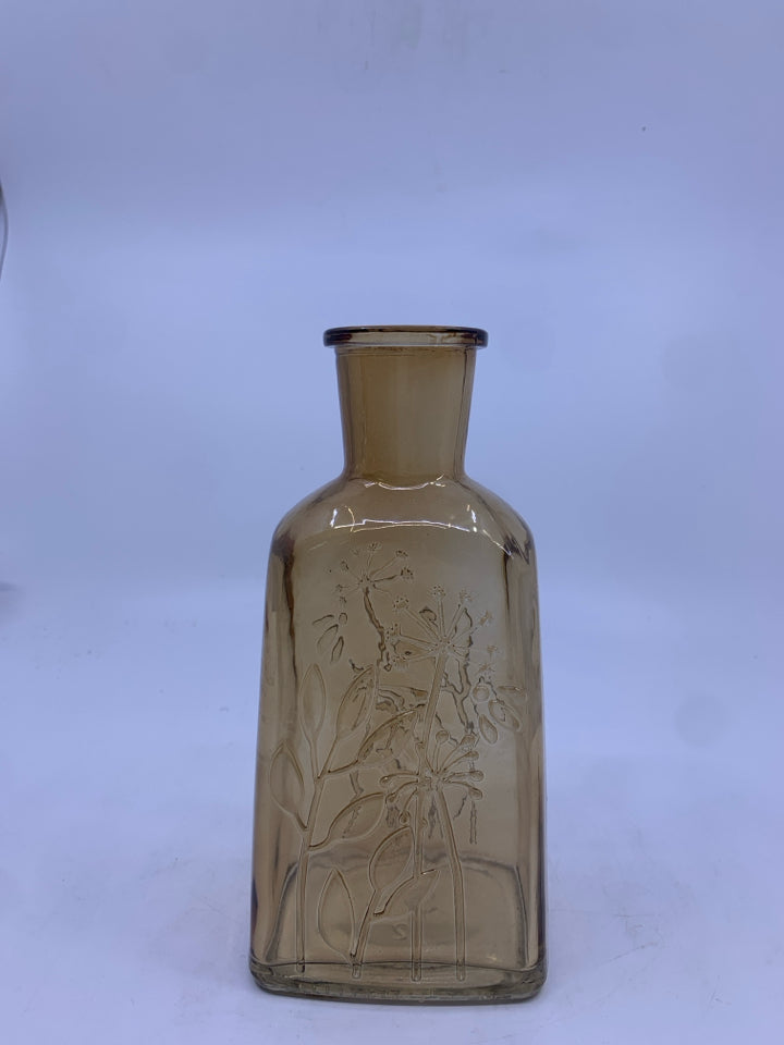 LIGHT BROWN GLASS BOTTLE VASE W/ EMBOSSED FLOWERS.