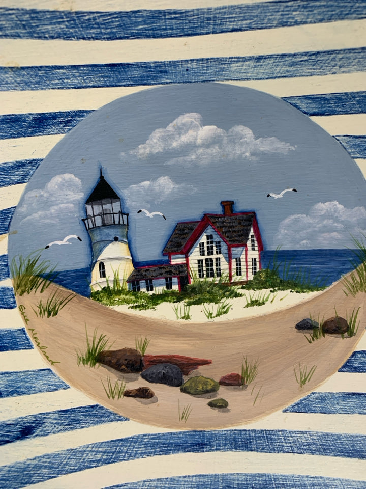 FOOTED WOOD BOWL W/ PAINTED LIGHT HOUSE BEACH SCENE SIGNED BY ARTIST.