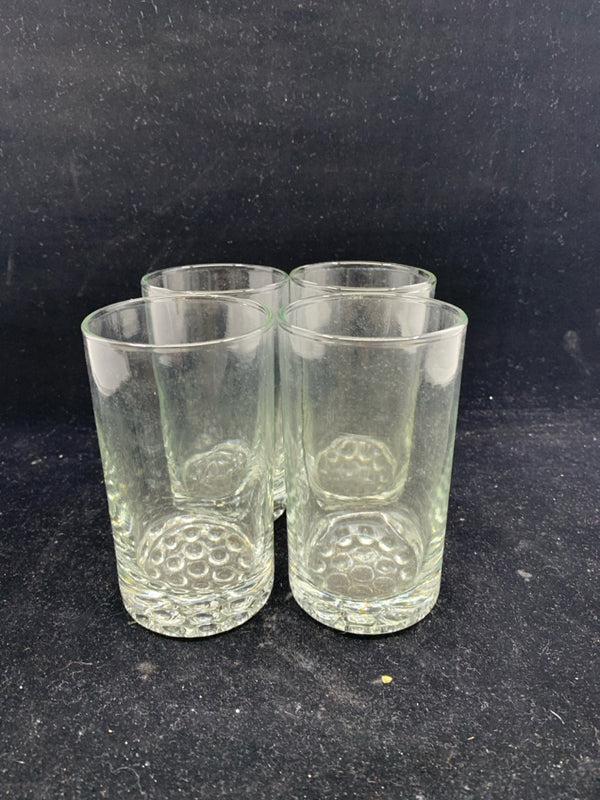 4 CLEAR GLASS JUICE GLASSES W/ BUBBLE PATTERN BOTTOM.