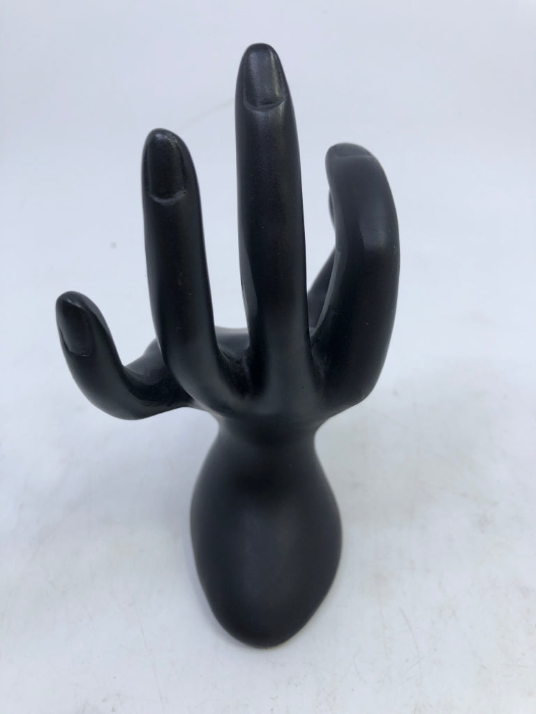 BLACK RESIN HAND RING HOLDER.