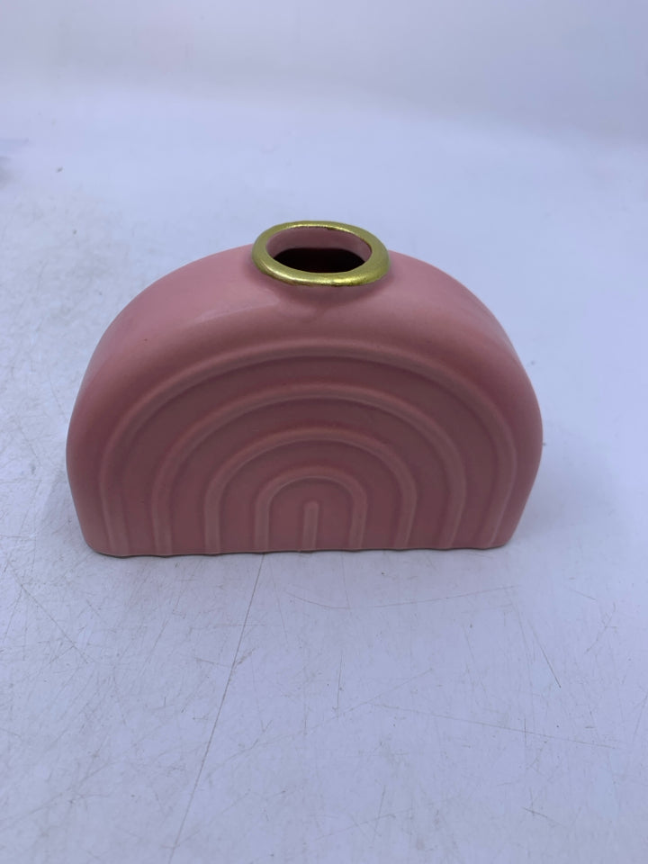 PINK CERAMIC RAINBOW SHAPED VASE.