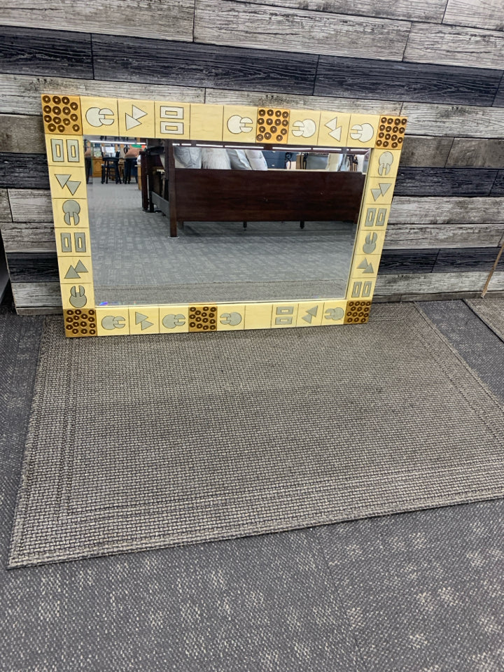 HEAVY WALL MIRROR W/SILVER SHAPES FRAME.