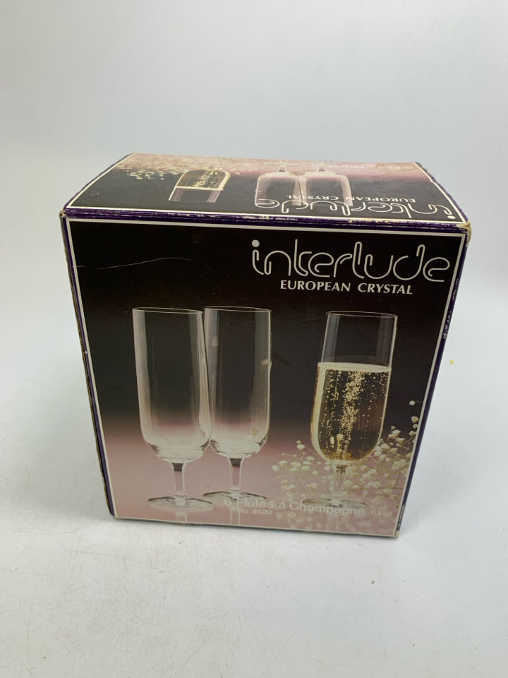 IN BOX 6 EUROPEAN CRYSTAL CHAMPAGNE FLUTES.