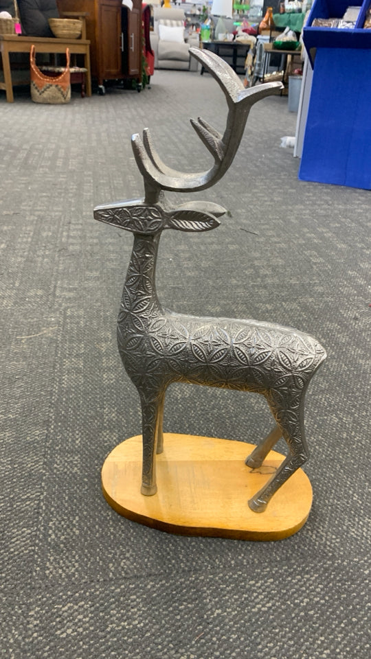 SILVER TEXTURED REINDEER W/WOOD BASE SCULPTURE.