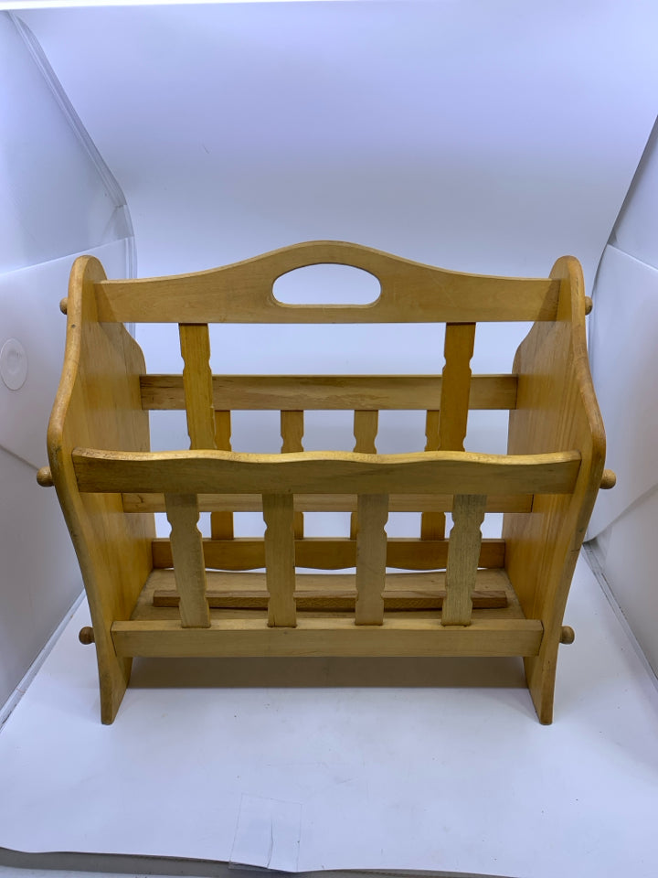 BLONDE FOOTED MAGAZINE RACK.