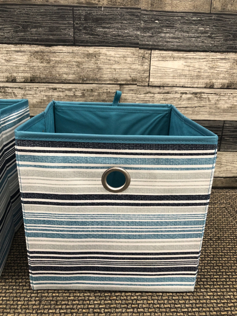 2 BLUE/TEAL FABRIC STORAGE BOXES.