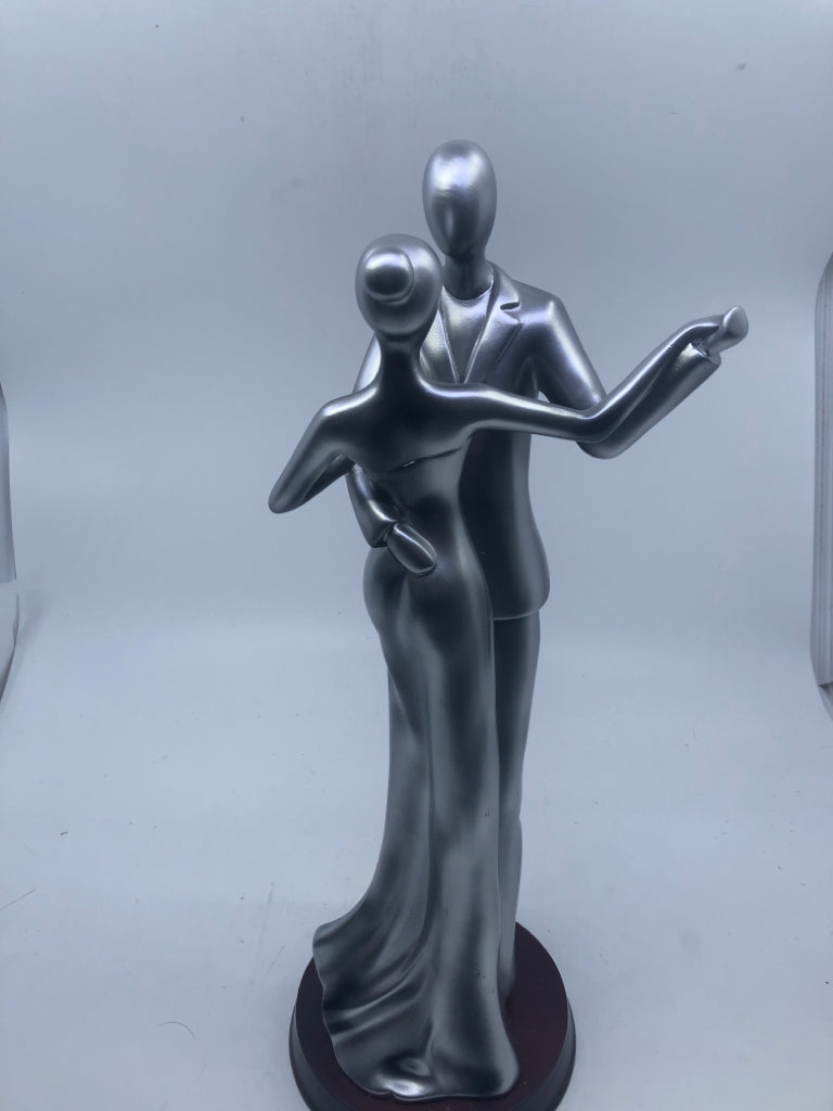 HEAVY SILVER MAN AND WOMAN FIGURE.