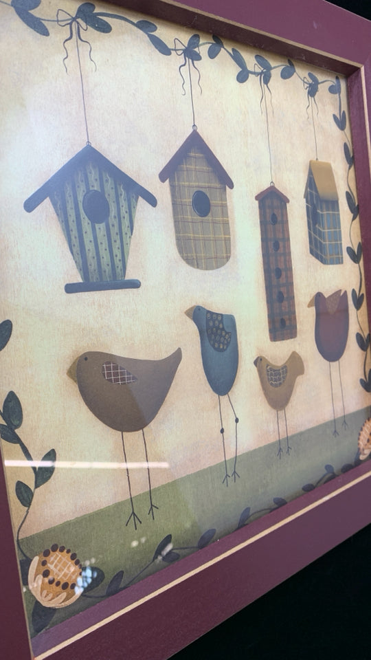 PRIMITIVE BIRDS W/BIRD HOUSES IN RED FRAME.