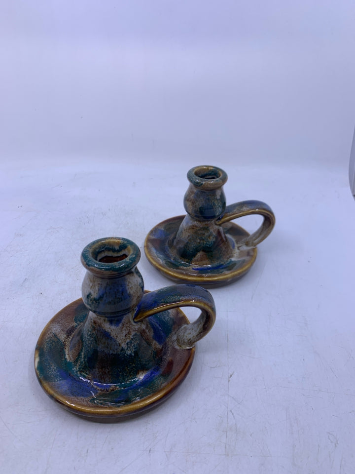 2 BROWN WHITE GREEN GLAZED TAPERED CANDLE HOLDERS W/ HANDLES.