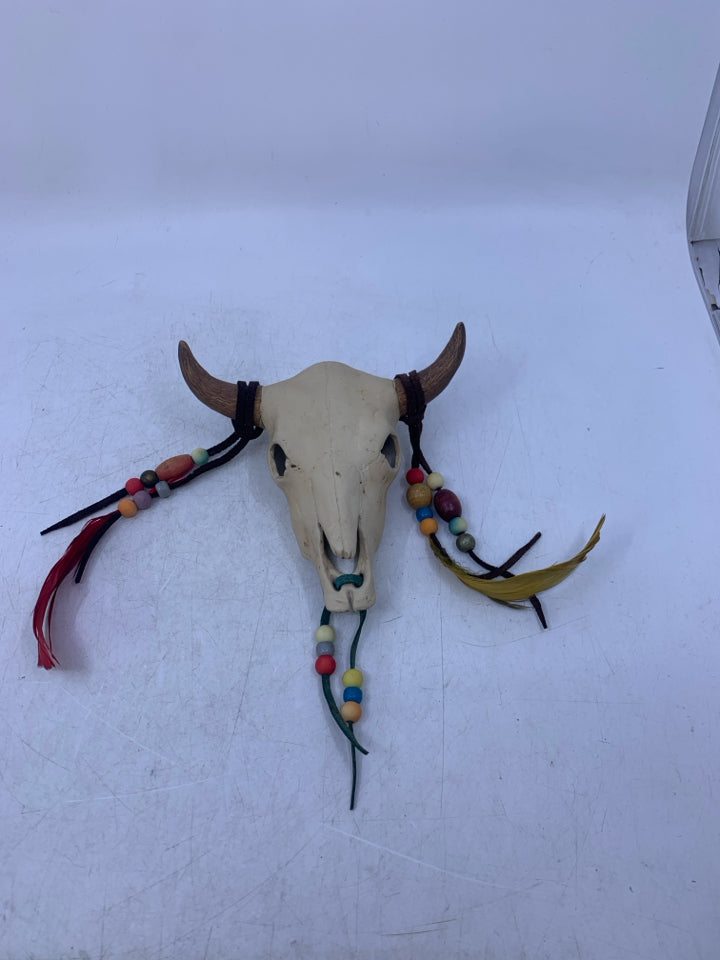 CERAMIC COW SKULL W/ HANGING BEADS/FEATHERS.