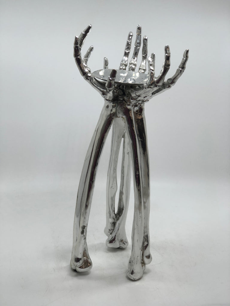 SILVER SKELETON HANDS PILLAR CANDLE HOLDER.