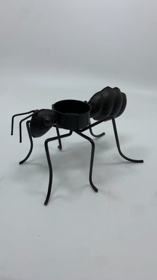 BROWN METAL ANT TEA LIGHT HOLDER.