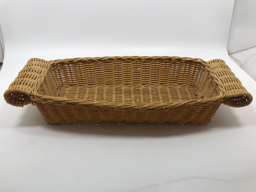 RECTANGULAR WICKER BASKET W FOLDED HANDLES.