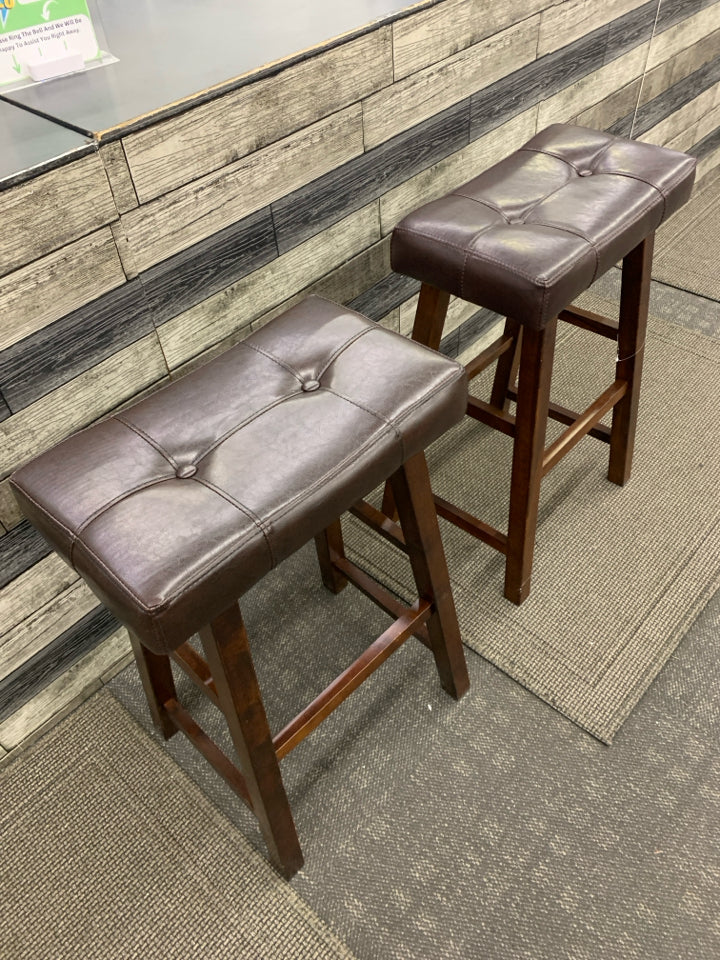 2 LEATHER SADDLE BAR STOOLS.