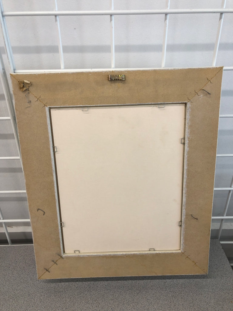 DAFFODIL IN WHITE DECORATIVE FRAME.
