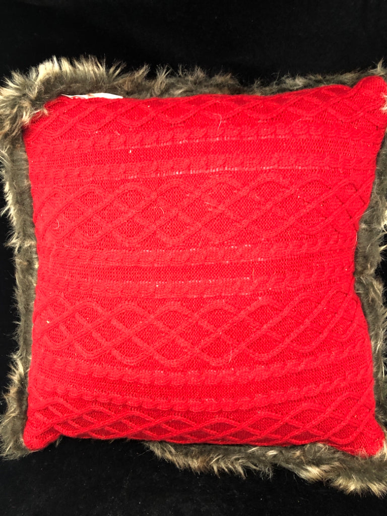 RED SWEATER PILLOW W/ FAUX FUR EDGE.