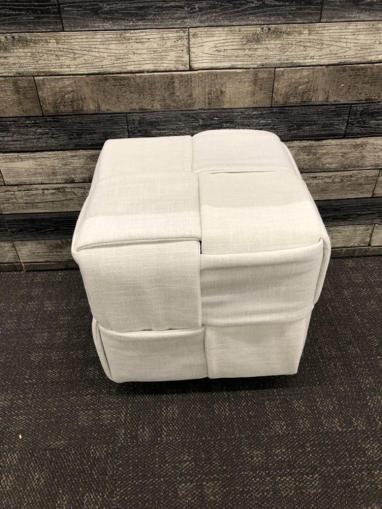 WHITE CUBE OTTOMAN ON WHEELS.