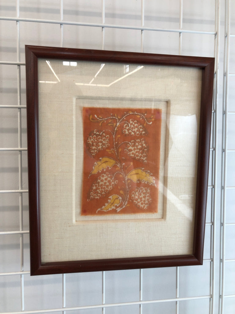 ORANGE FLORAL FABRIC PRINT IN BROWN FRAME.