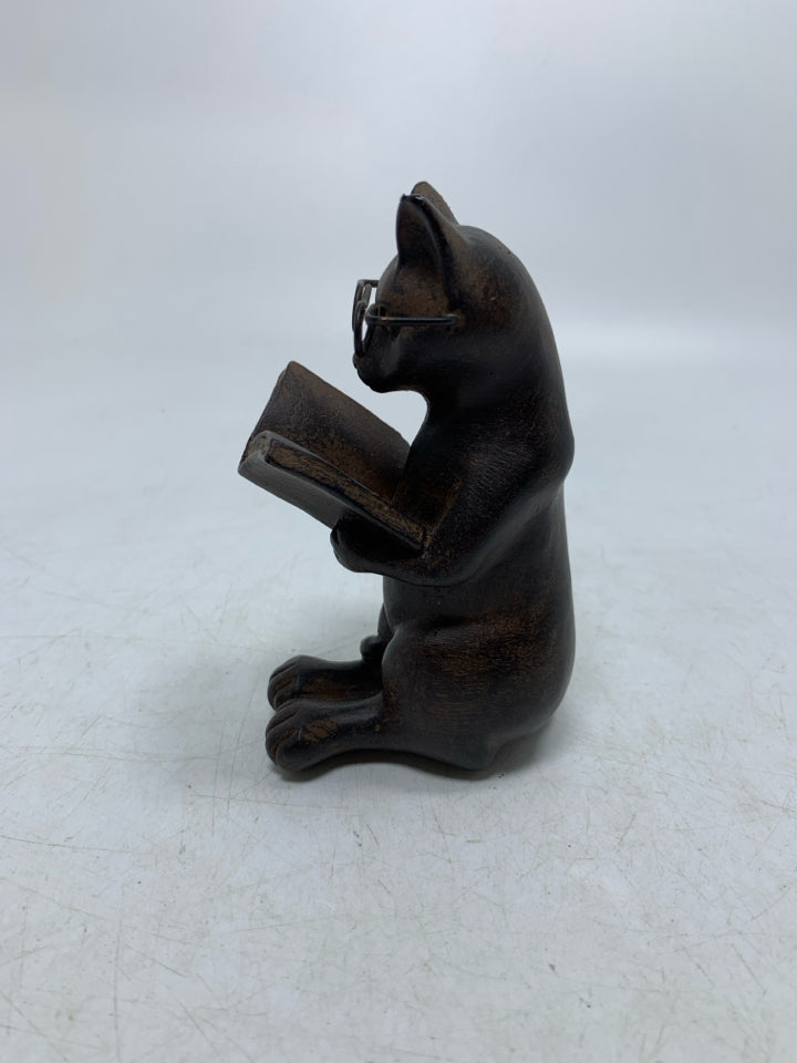 BROWN RESIN CAT READING.