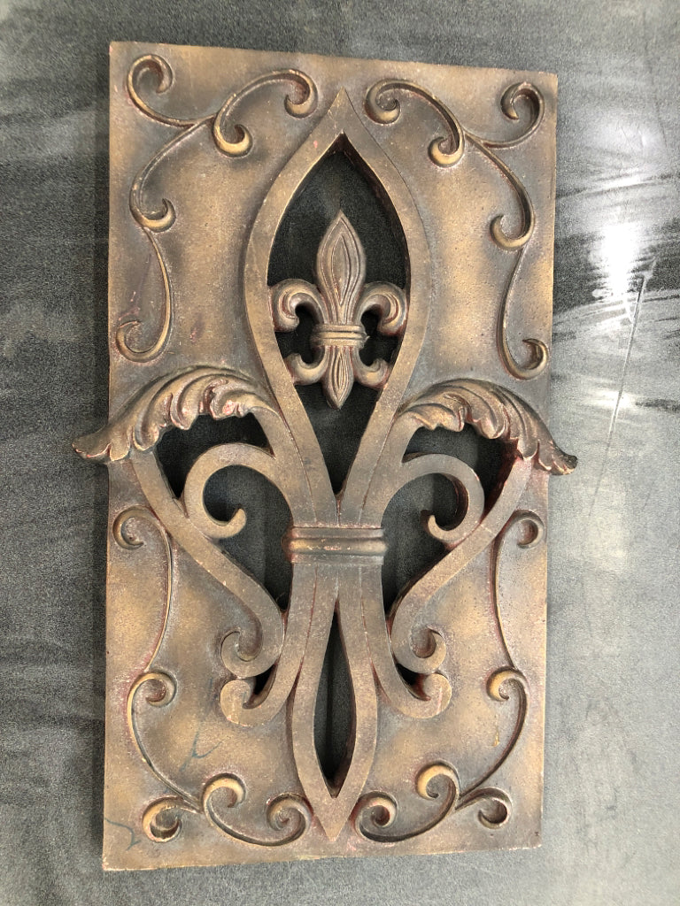 BROWN HEAVY FLEUR DE LIS WALL HANGING.