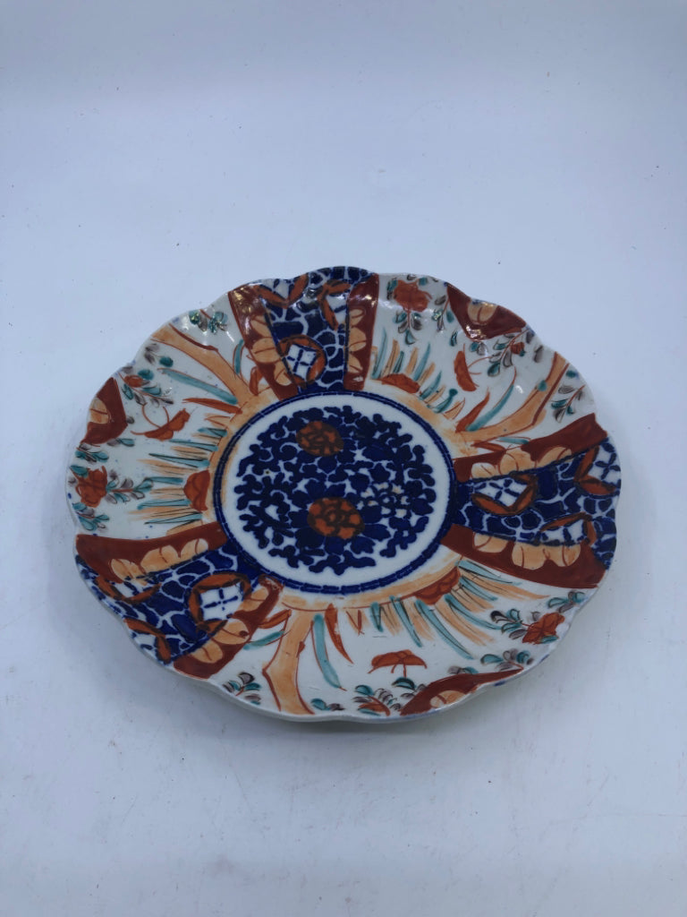 BLUE AND RED ABSTRACT FLORAL PLATE.