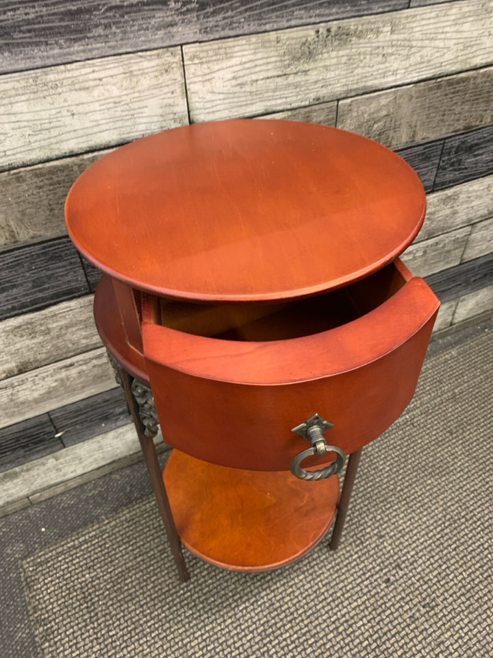 VTG ROUND RED WOOD END TABLE W/ DRAWER.