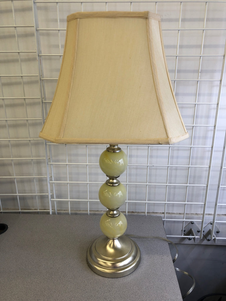 YELLOW GLASS STACKING BALL BASE LAMP W TAN SHADE.