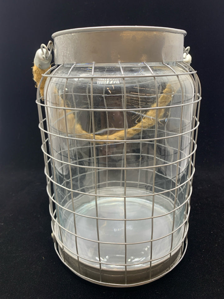 GLASS IN METAL CANDLE LANTERN W/BURLAP HANDLE.