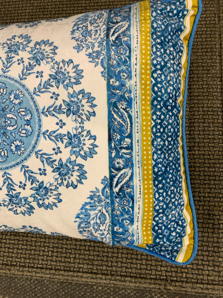LONG BLUE FLORAL PILLOW W/YELLOW ACCENTS.