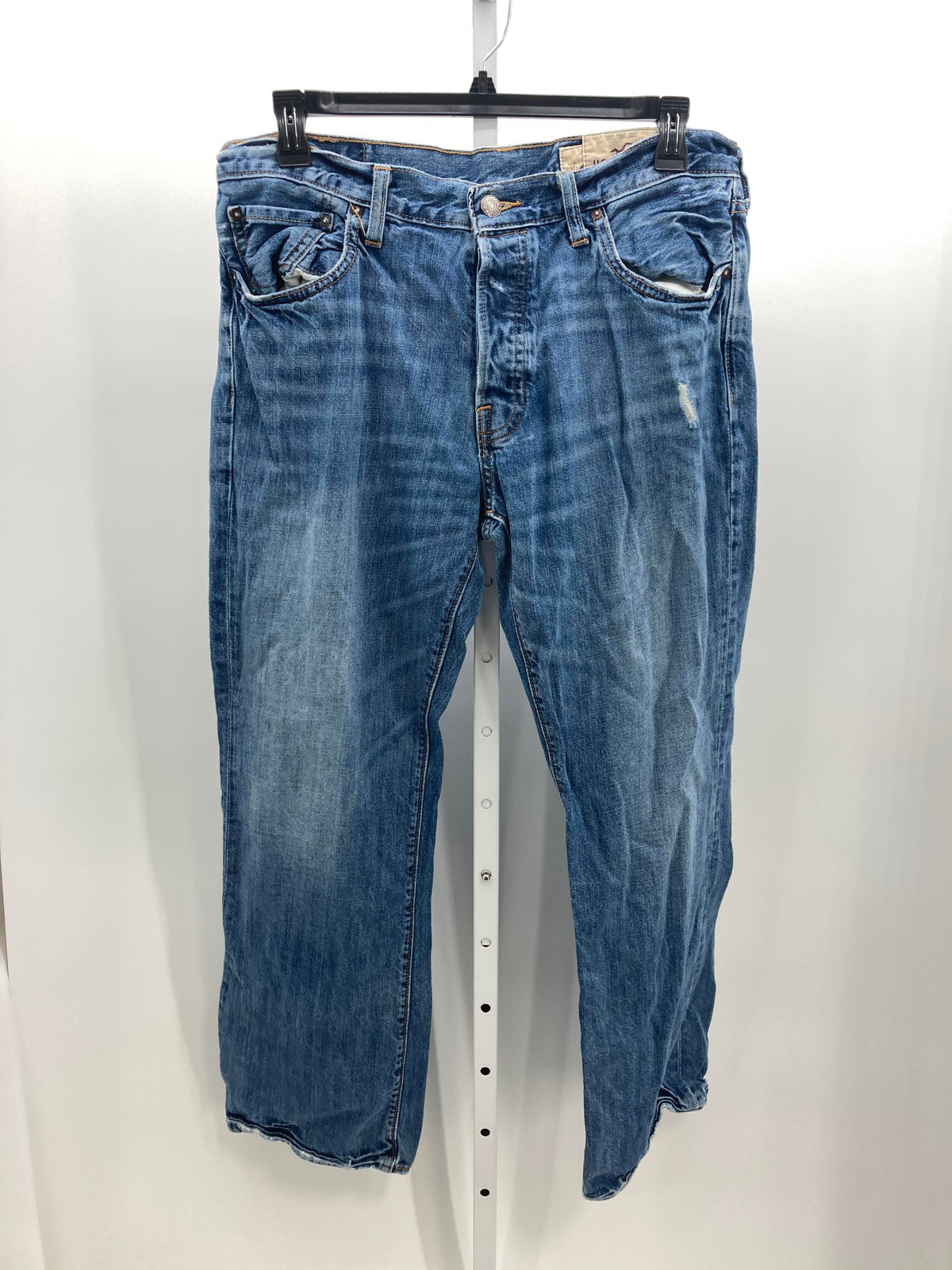 DISTRESSED BUTTON FLY JEANS