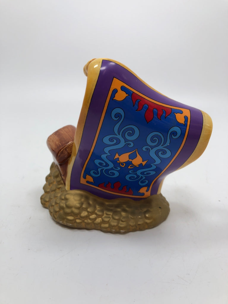 CERAMIC ALADDIN CARPET FIGURINE.