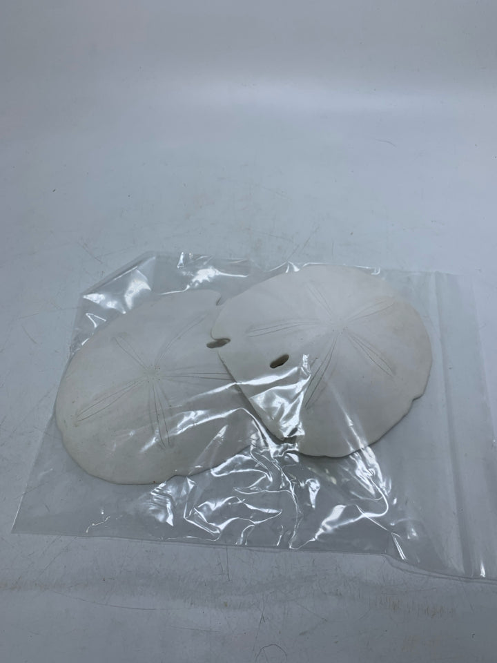 2 LARGE SAND DOLLARS IN BAG.
