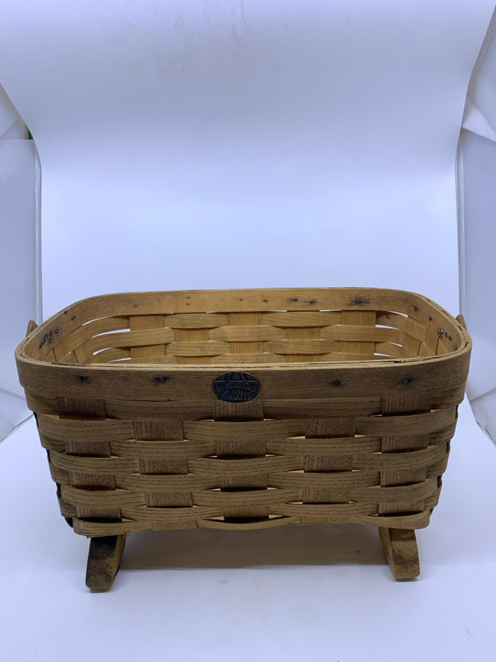 FOOTED PETERBORO BASKET W PLASTIC LINER AND HANDLE.