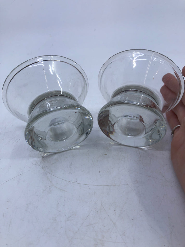 2 SMALL GLASS CANDLE HOLDERS.