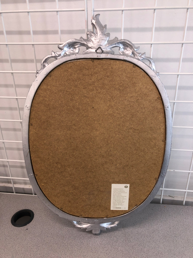 SILVER ORNATE MIRROR.