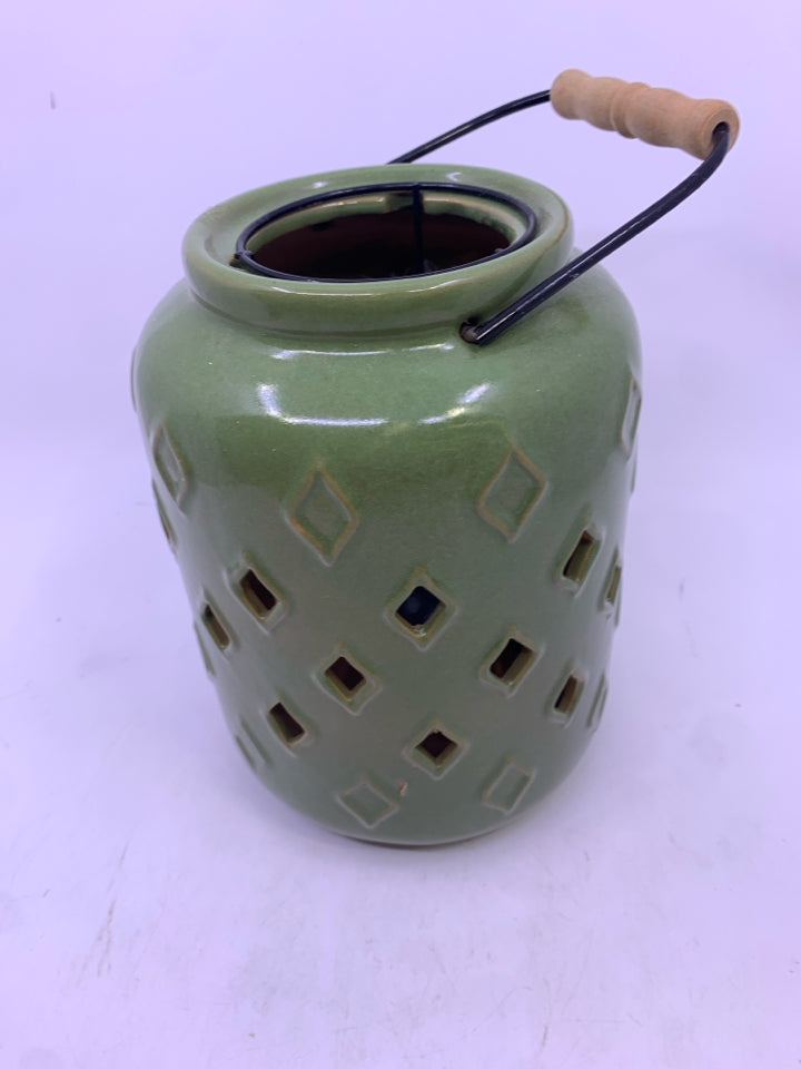 GREEN CERAMIC PIERCED CANDLE LANTERN.