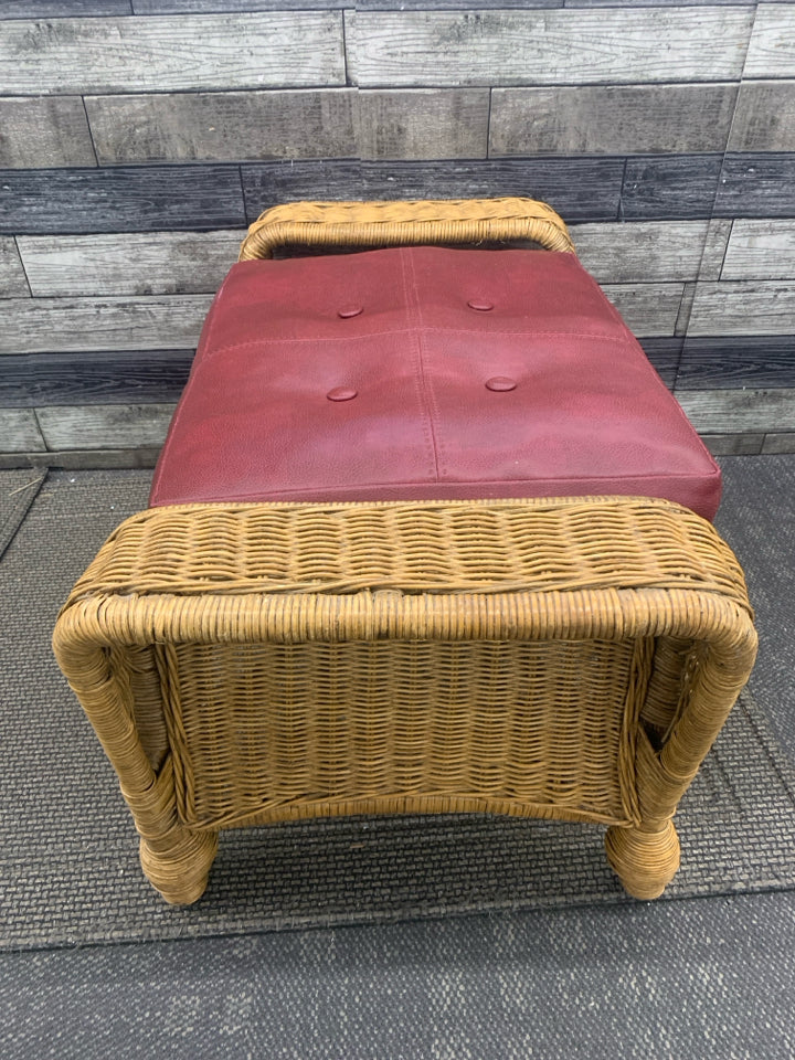 WICKER FOOT STOOL BENCH AND RED CUSHION.