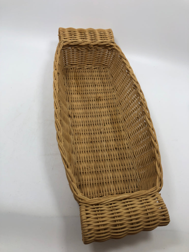 RECTANGULAR WICKER BASKET W FOLDED HANDLES.