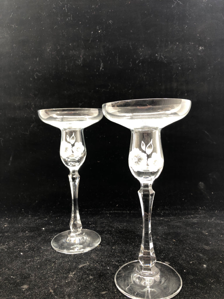 2 FOOTED GLASS FLORAL ETCHED TAPER CANDLE HOLDERS.