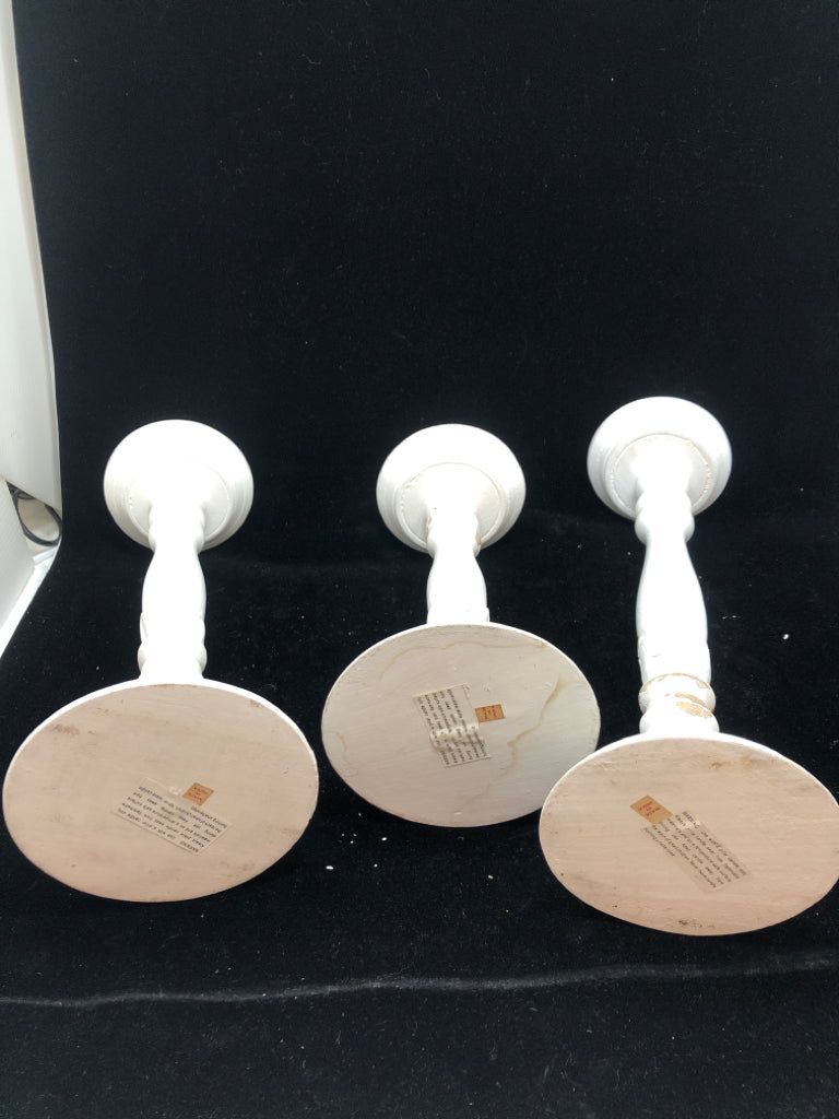 3 DISTRESSED WOODEN CANDLE STICK HOLDERS.