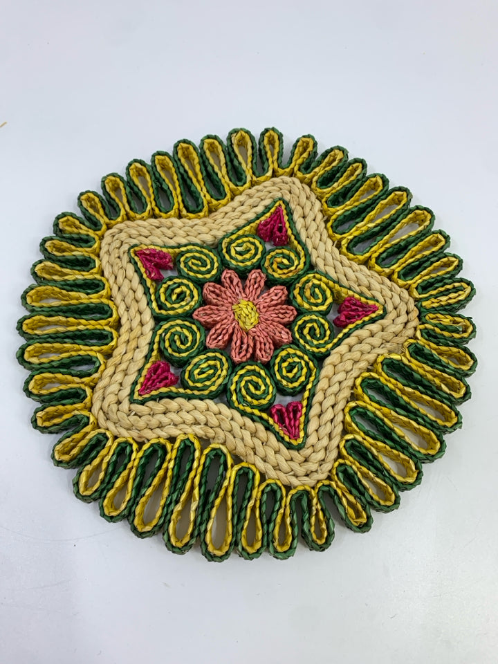 ROUND WOVEN GREEN/YELLOW PINK FLOWER STRAW TRIVET.