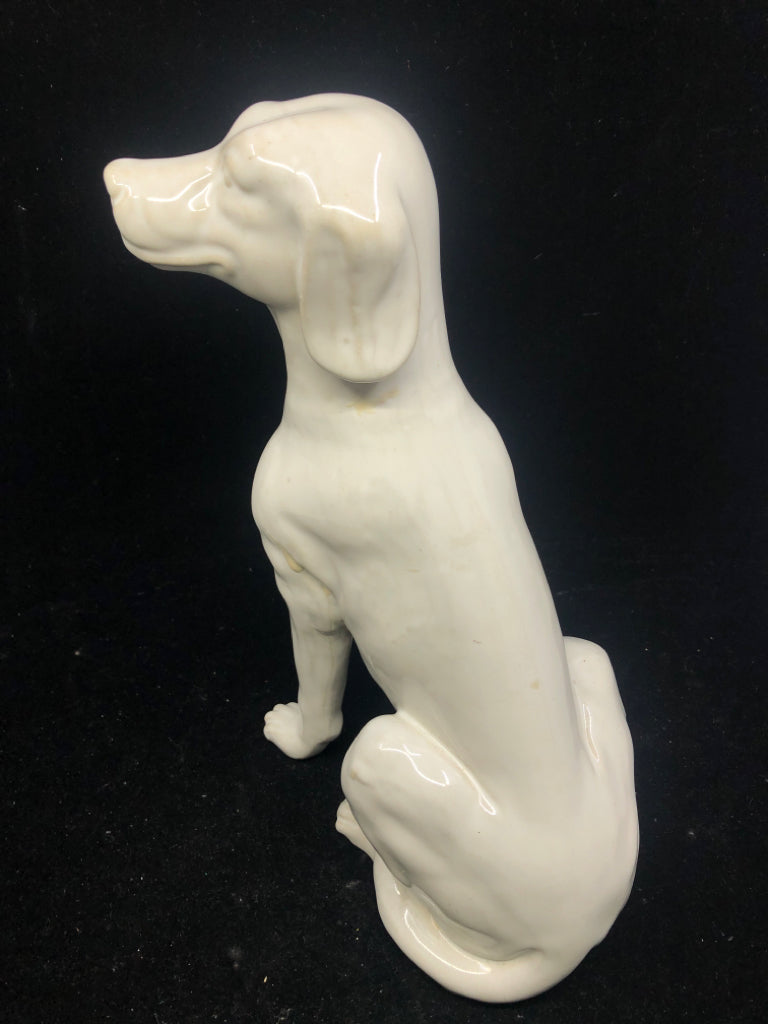 WHITE CERAMIC SITTING DOG.