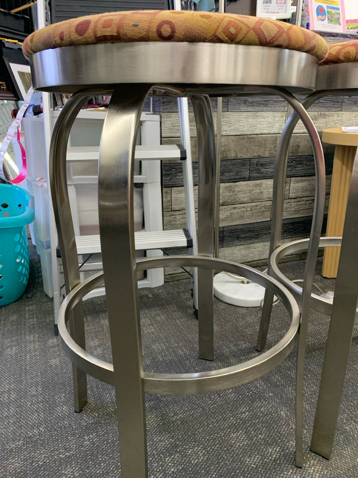 2 TALL SILVER LEG ORANGE CUSHION STOOLS.