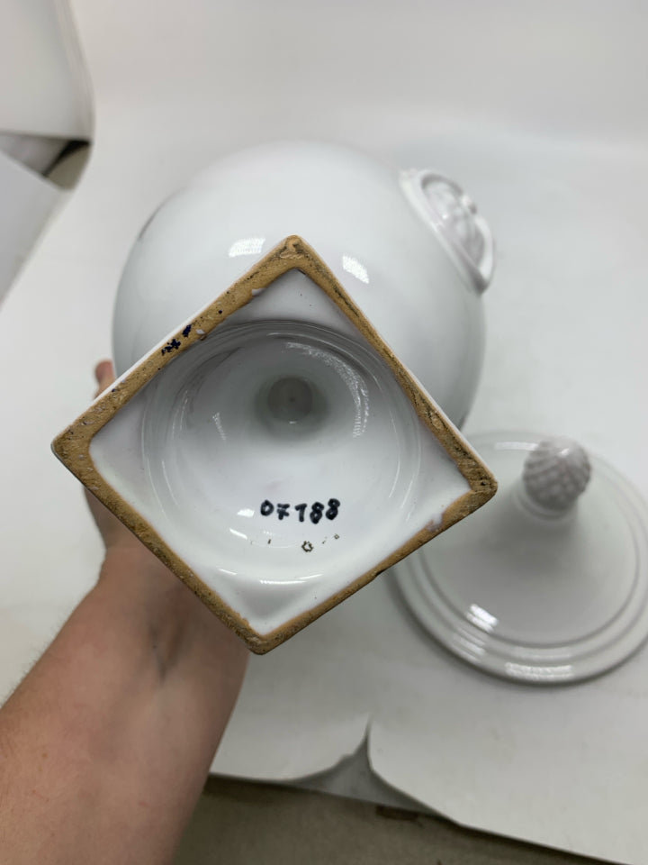 FOOTED URN SHAPED CANISTER W/ POINTED TOP.