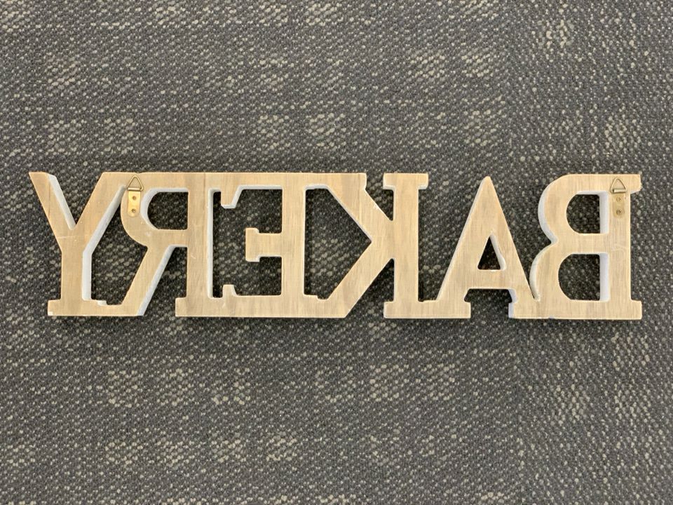 WHITE BAKERY SIGN.