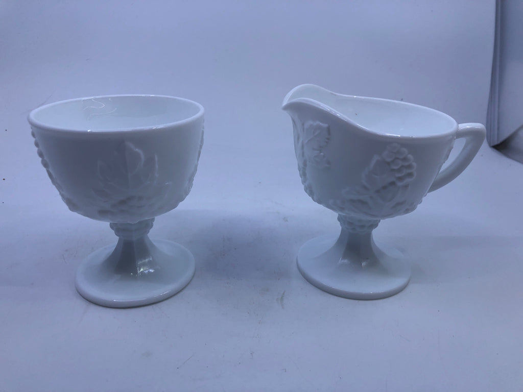 VTG 2PC FOOTED MILK GLASS EMBOSSED SUGAR AND CREAMER.