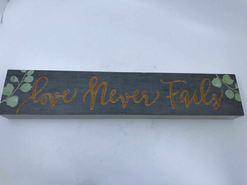 LOVE NEVER FAILS-BLOCK SIGN.