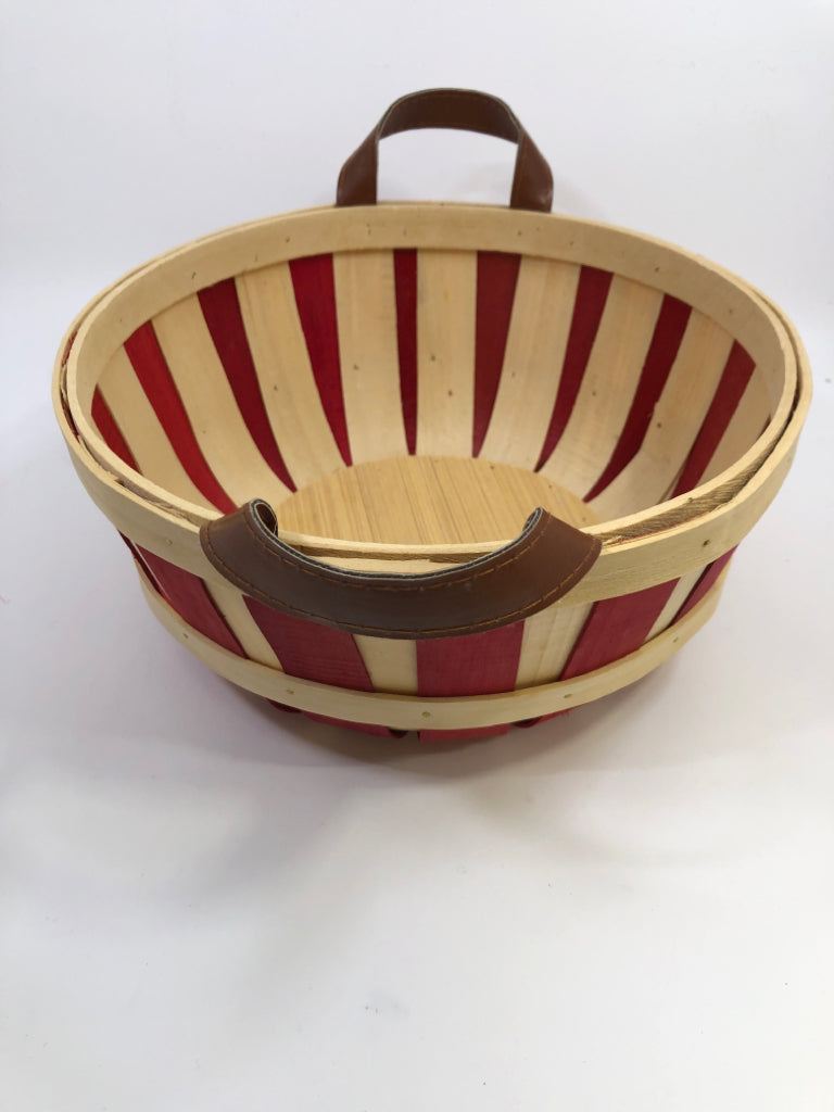 ROUND BASKET W/RED AND FAUX LEATHER HANDLES.