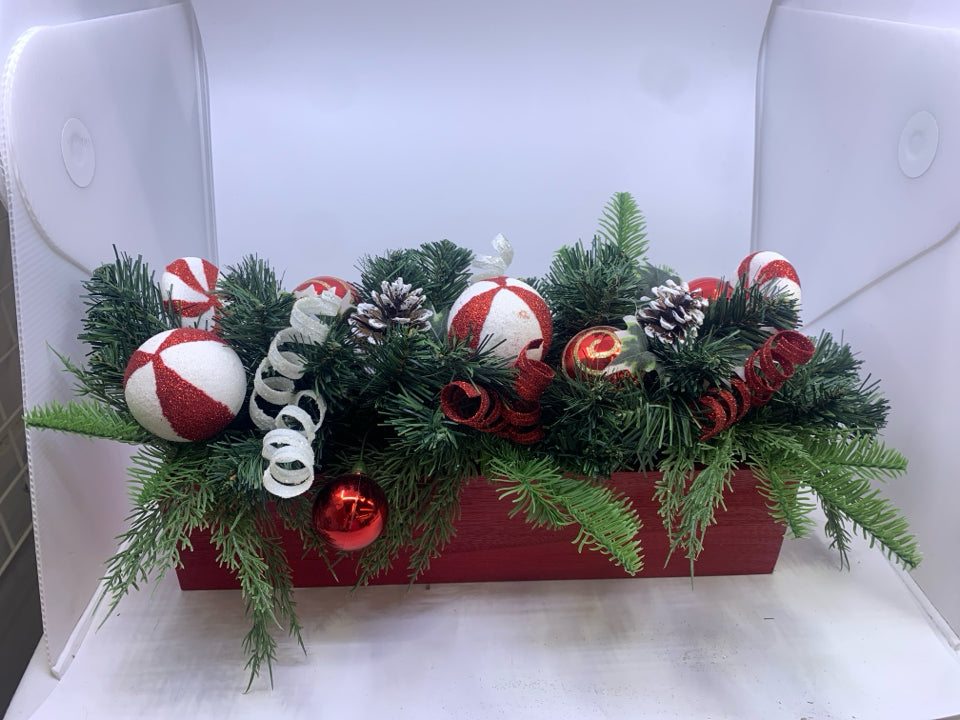 RED CRATE W CHRISTMAS ORNAMENTS ARRANGEMENT.